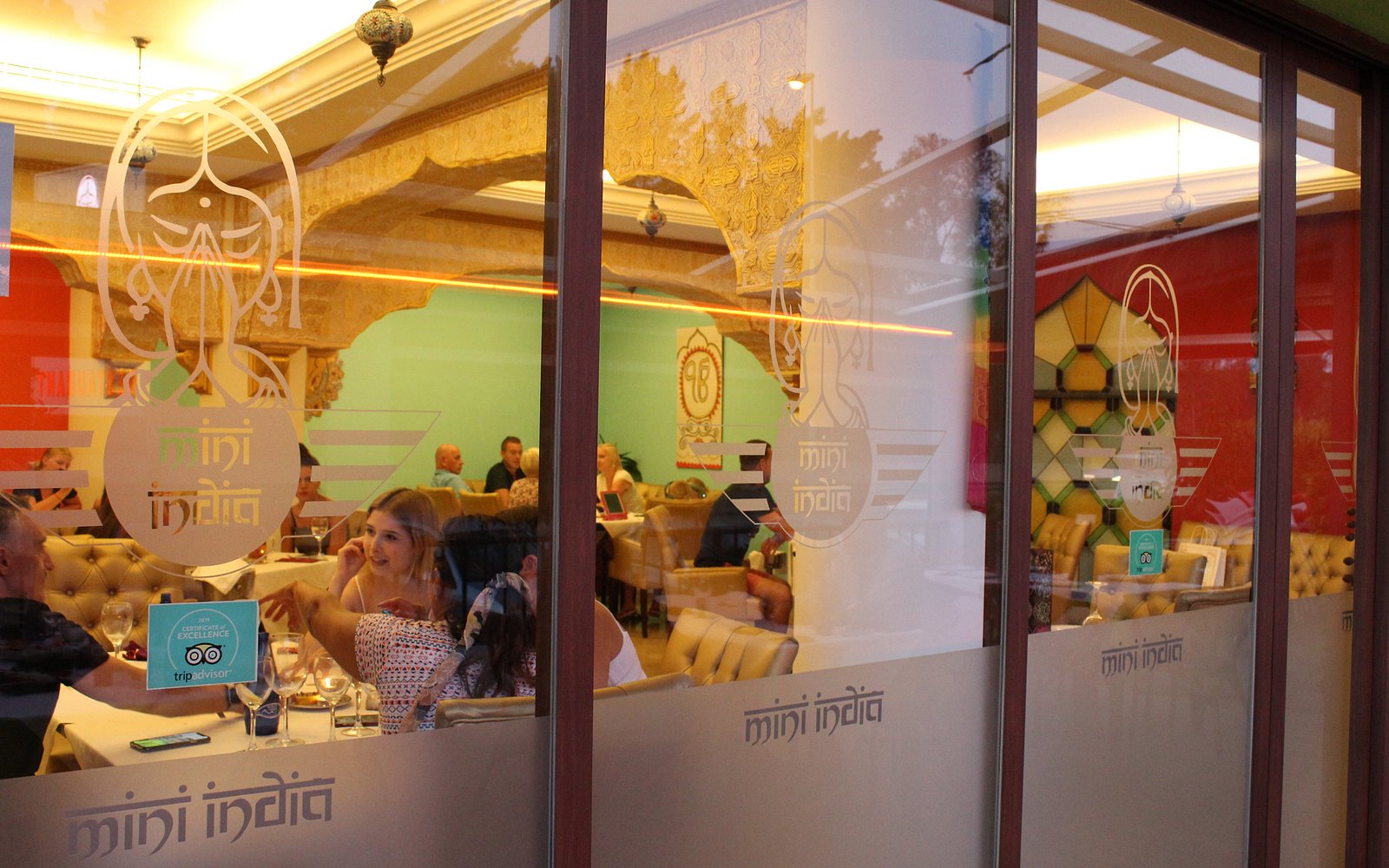 Mini India Elviria storefront at night